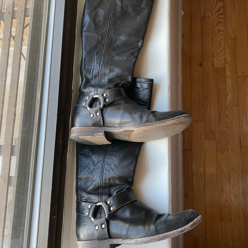 Tall Frye motorcycle boots.